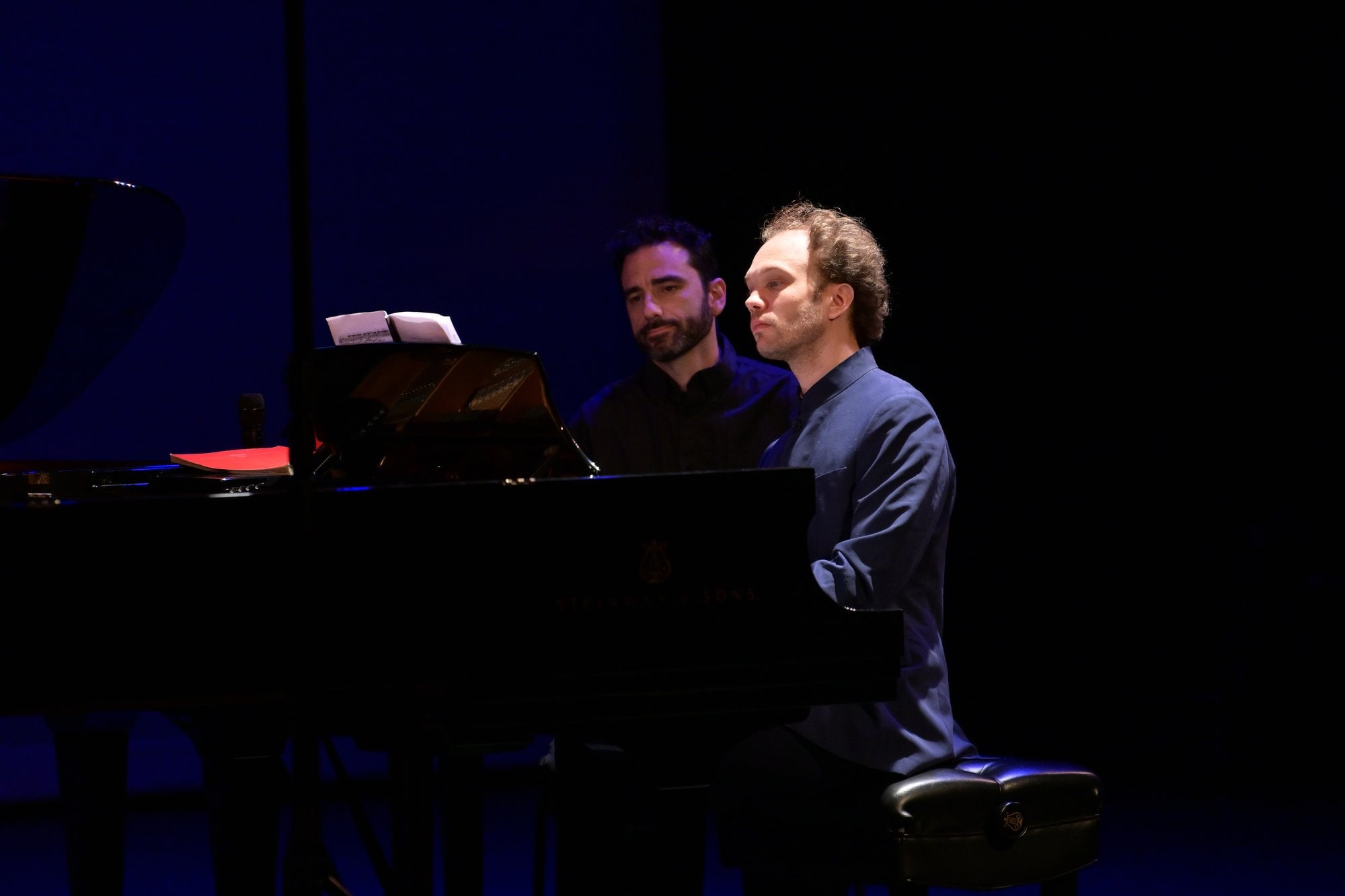 Two pianists at the keyboard during the first duo of the afternoon